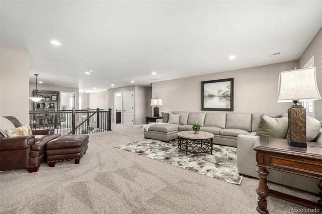 a view of walk in closet with clothes