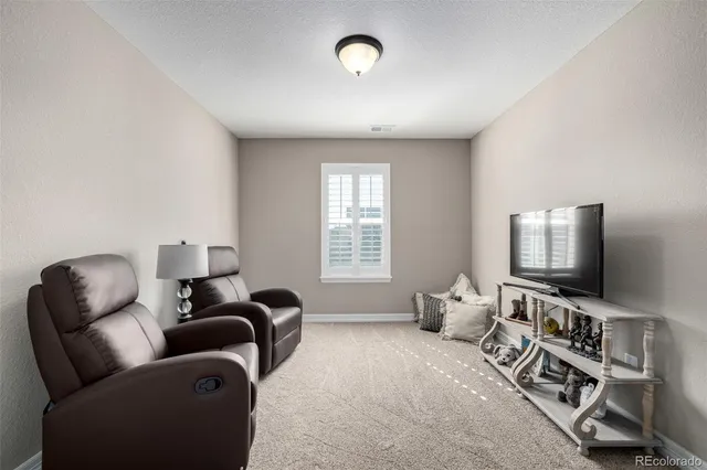 a kitchen with granite countertop kitchen island a sink stainless steel appliances and cabinets