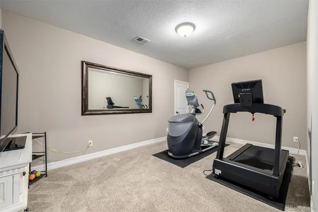 an aerial view of a building with parking