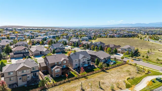 a house with a swimming pool in front of it