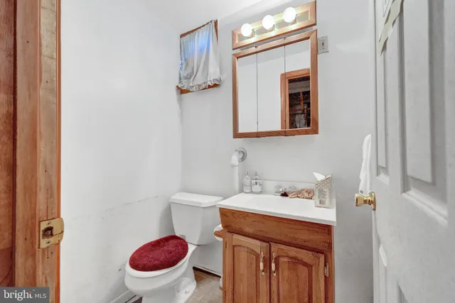 a bathroom with a sink vanity granite tub and shower