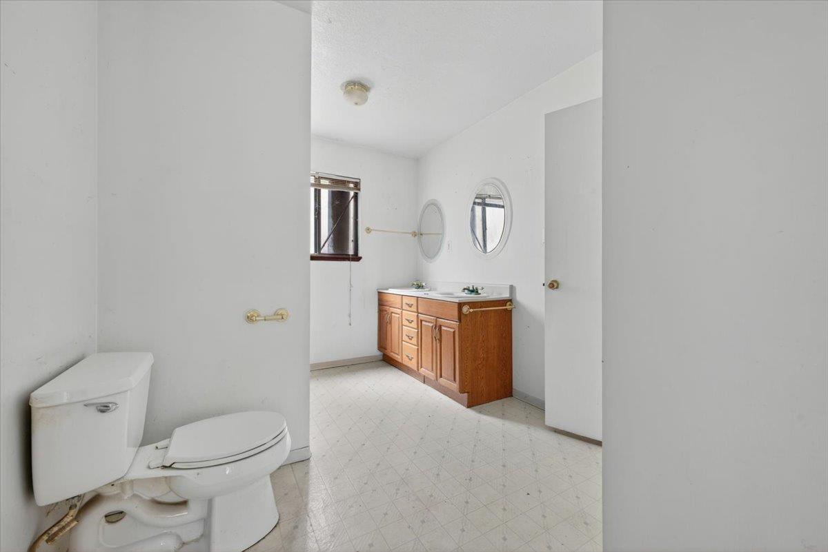 46404 Arroyo Seco Road Greenfield, CA 93927 - Photo 13 of 53 a bathroom with a toilet a sink and mirror