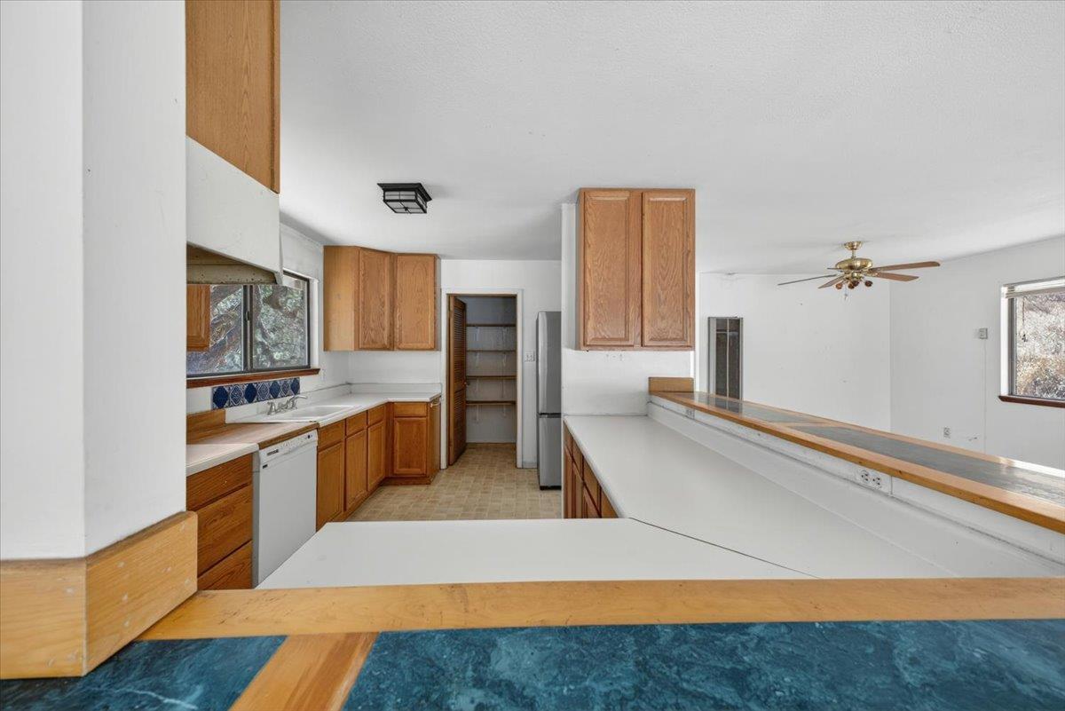 46404 Arroyo Seco Road Greenfield, CA 93927 - Photo 23 of 53 a large kitchen with stainless steel appliances granite countertop a large counter top and a stove