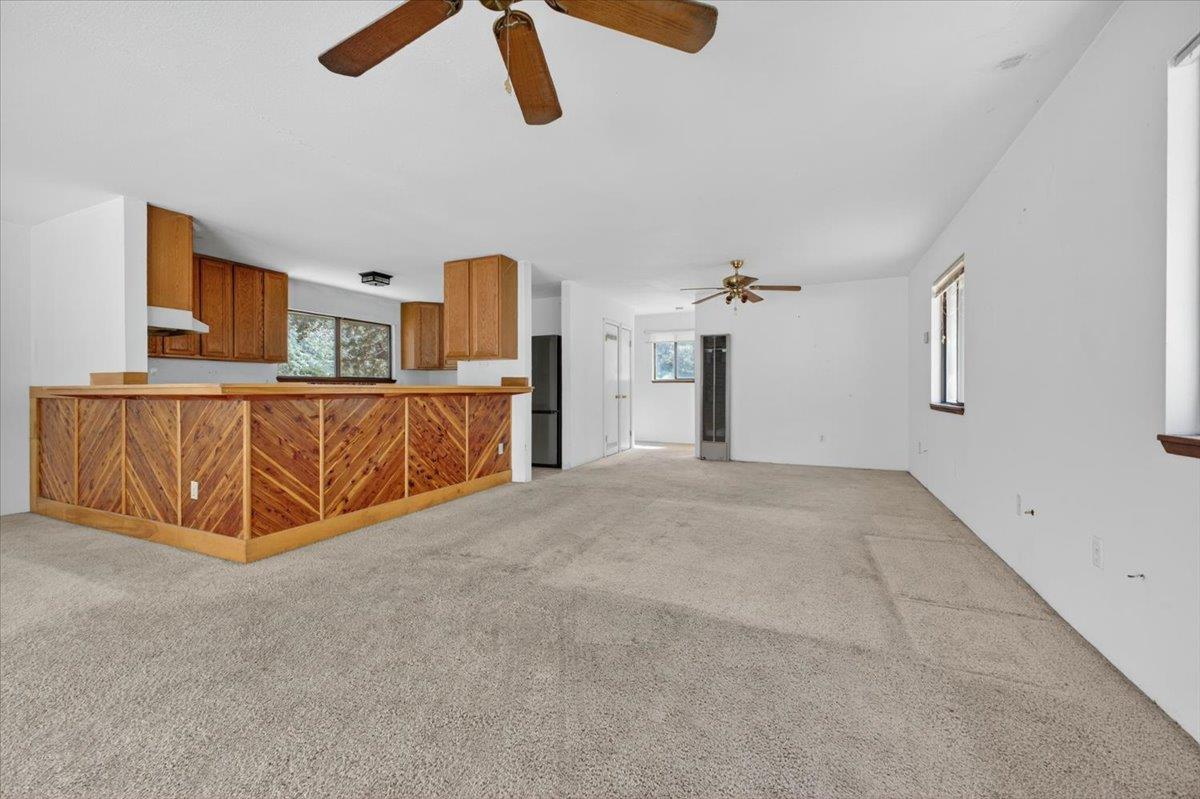 46404 Arroyo Seco Road Greenfield, CA 93927 - Photo 26 of 53 a spacious bedroom with a bed and a chandelier