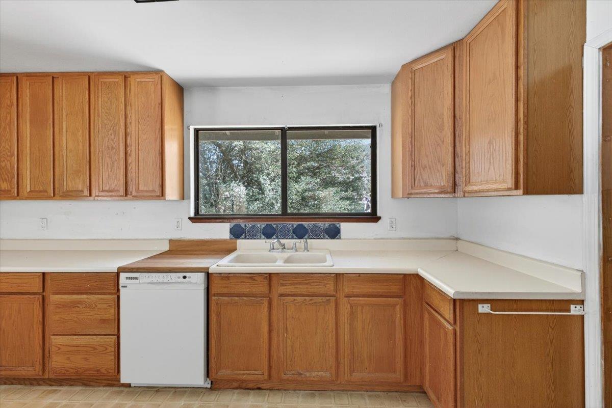 46404 Arroyo Seco Road Greenfield, CA 93927 - Photo 28 of 53 a utility room with a sink cabinets and a window
