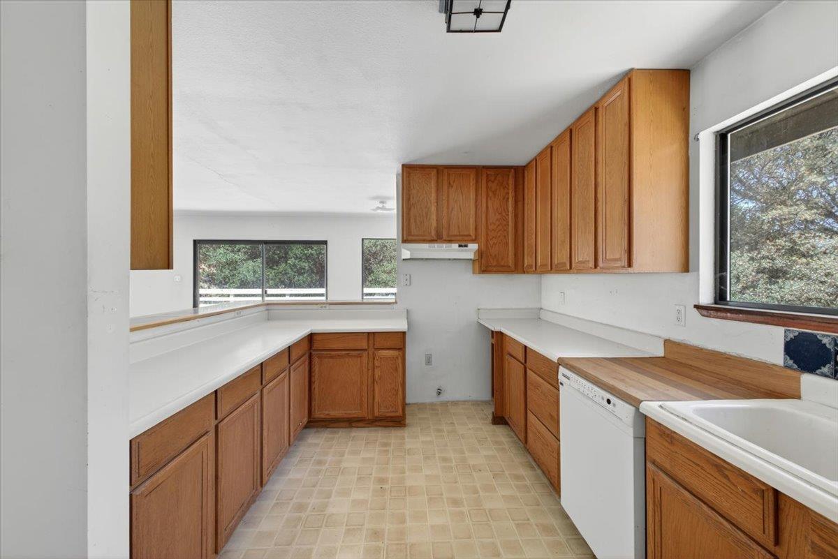 46404 Arroyo Seco Road Greenfield, CA 93927 - Photo 29 of 53 a kitchen with a sink stove and cabinets