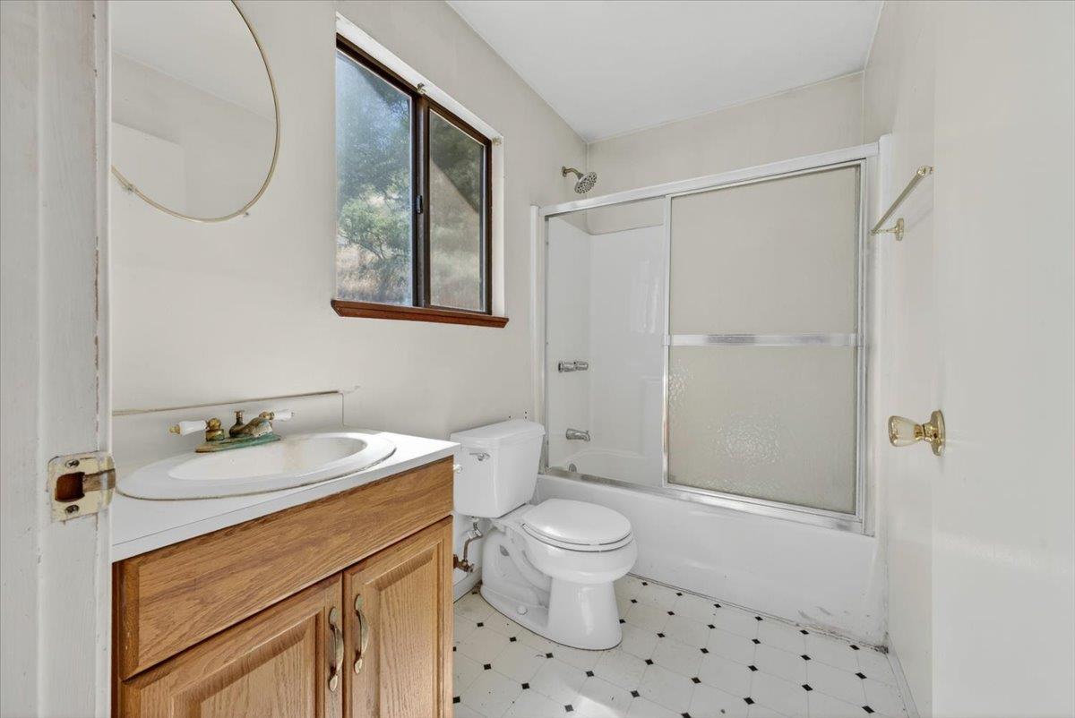 46404 Arroyo Seco Road Greenfield, CA 93927 - Photo 31 of 53 a bathroom with a sink a toilet and a mirror