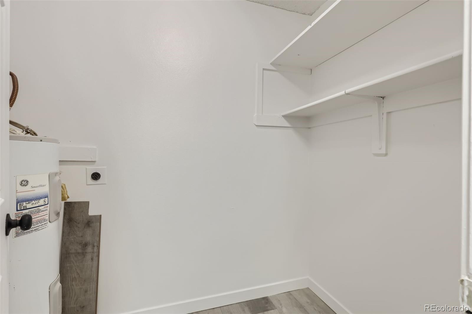 1845 Kendall Street, Unit 103A Denver, CO 80214 - Photo 11 of 11 a view of storage and utility room with racks on the wall
