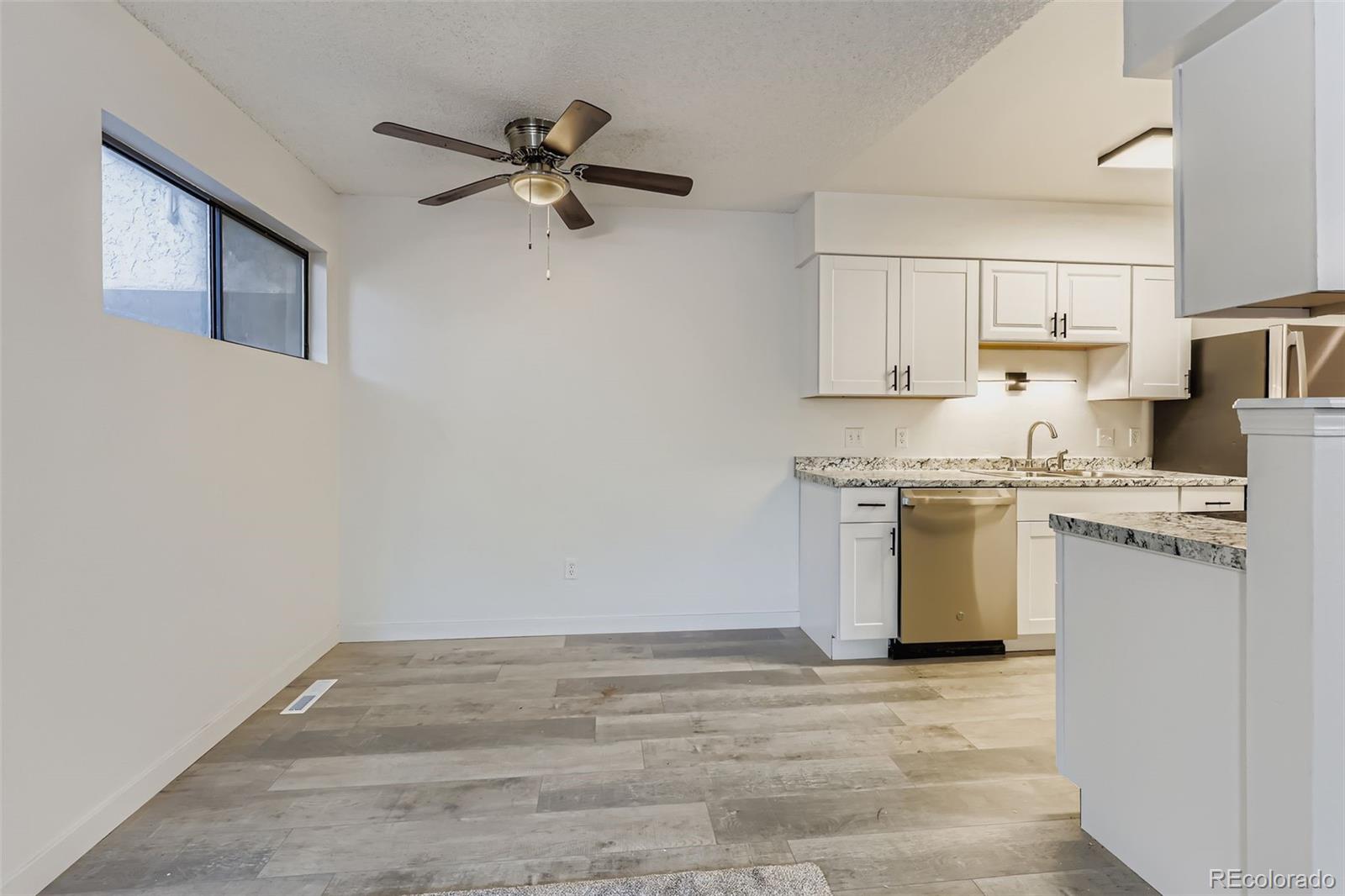 1845 Kendall Street, Unit 103A Denver, CO 80214 - Photo 6 of 11 a view of kitchen with stainless steel appliances cabinets