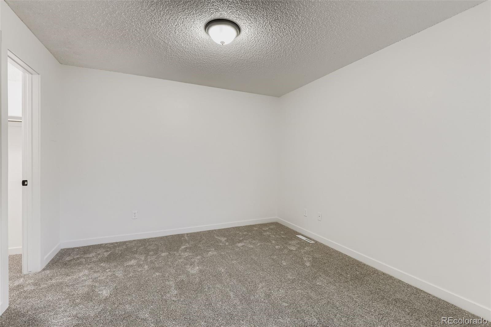1845 Kendall Street, Unit 103A Denver, CO 80214 - Photo 7 of 11 an empty room with a empty space