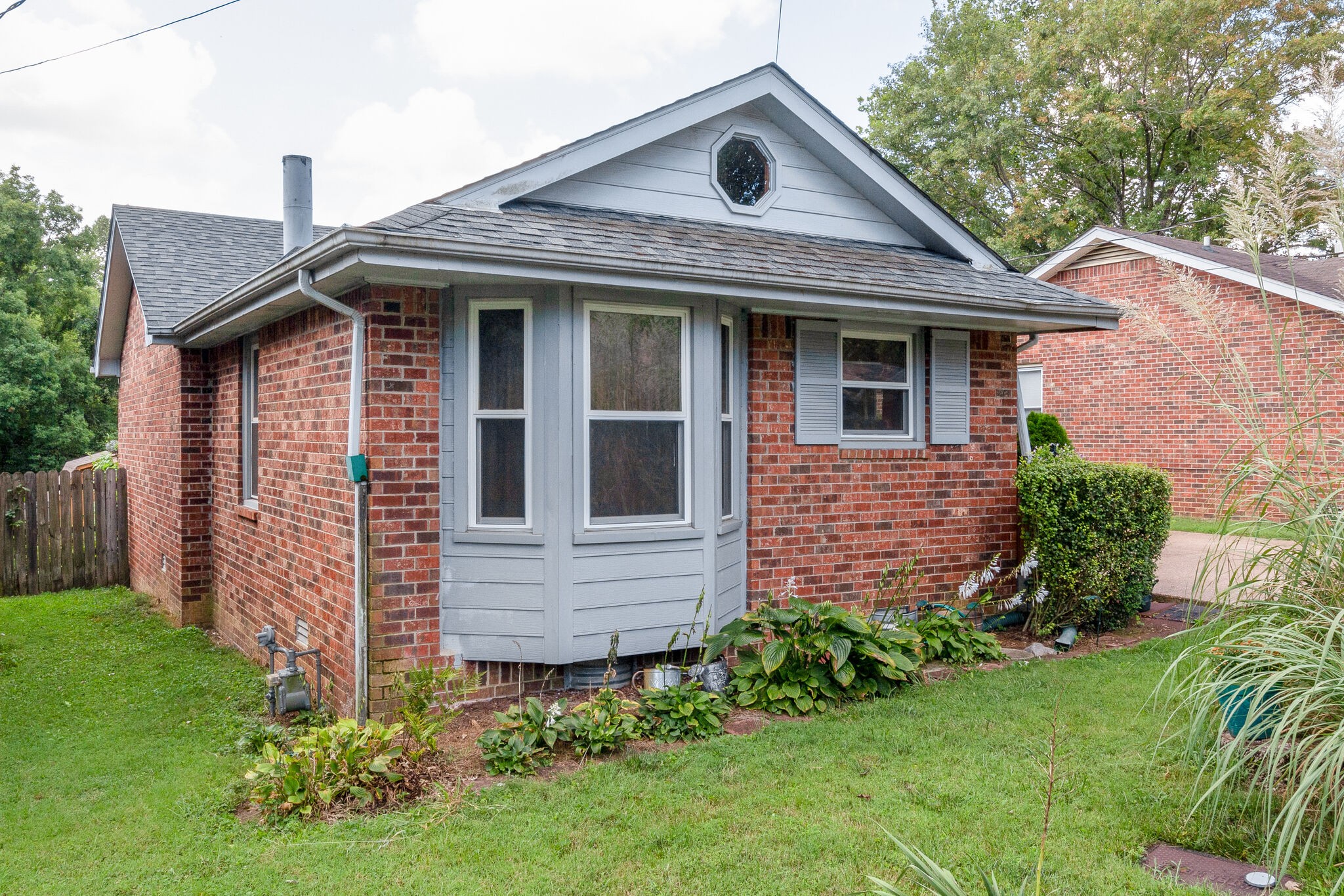 1216 Idlewild Place Madison, TN 37115 - Photo 1 of 24 a front view of a house with garden