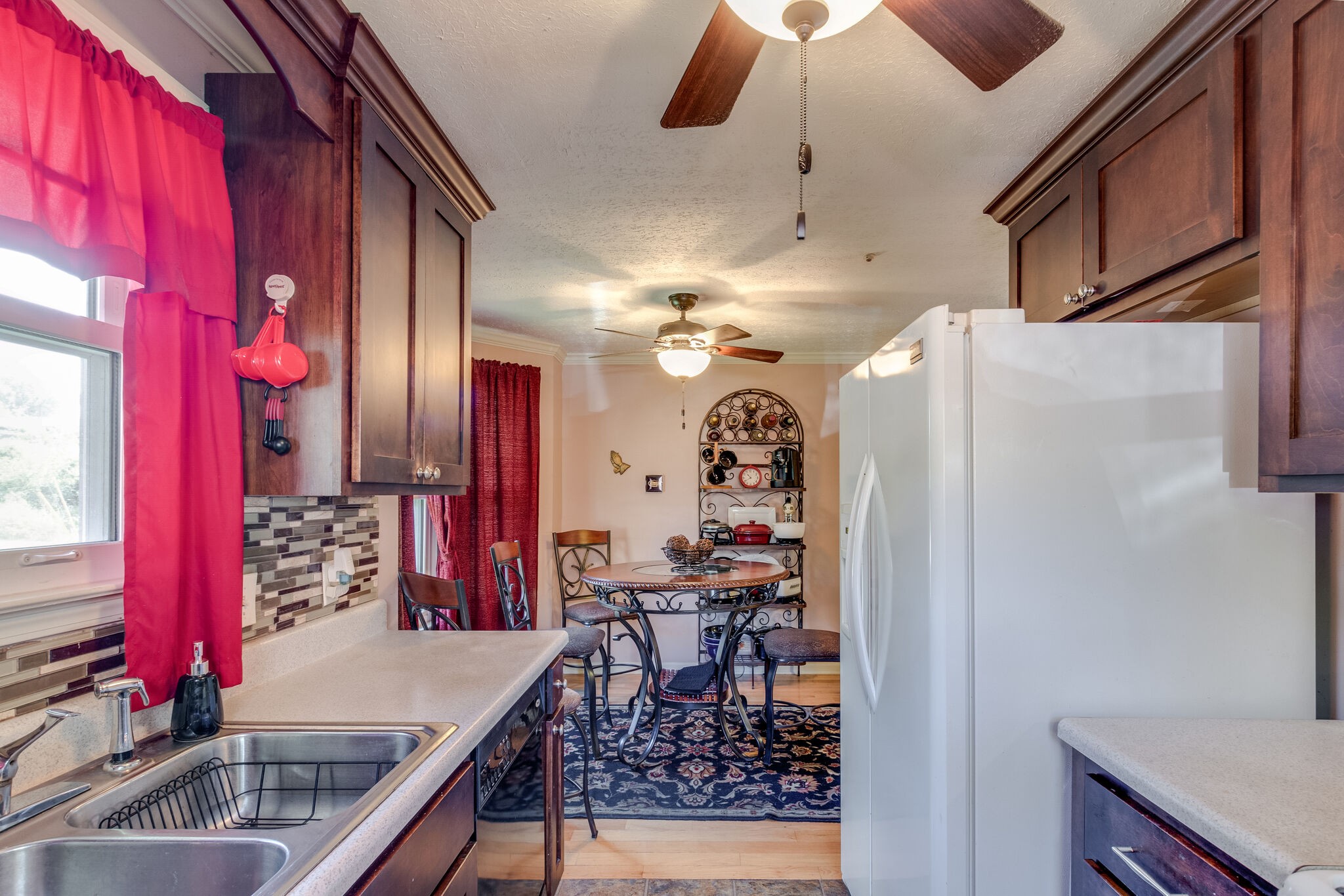 1216 Idlewild Place Madison, TN 37115 - Photo 10 of 24 a view of a hallway with dining area and chandelier