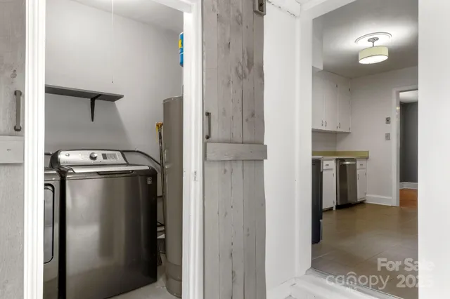 a view of a kitchen with a refrigerator and a stove