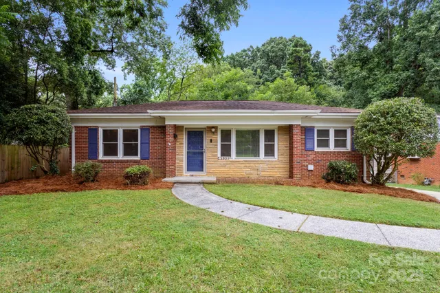 front view of a house that has a yard