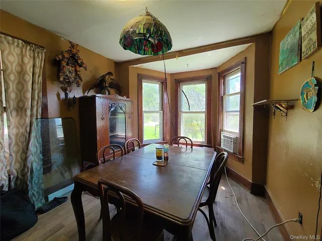 a view of a dining room with furniture window and outside view