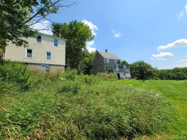 a backyard of a house with lots of green space