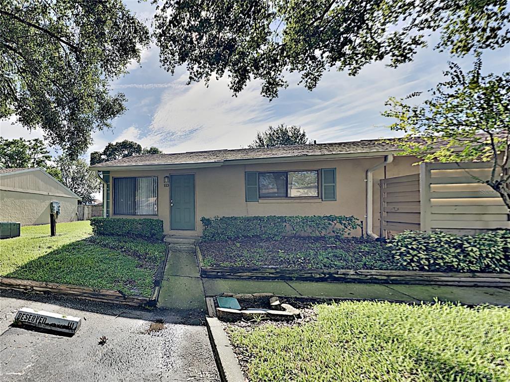 220 Cherokee Court, Unit 113 Altamonte Springs, FL 32701 - Photo 1 of 1 front view of a house with a garden