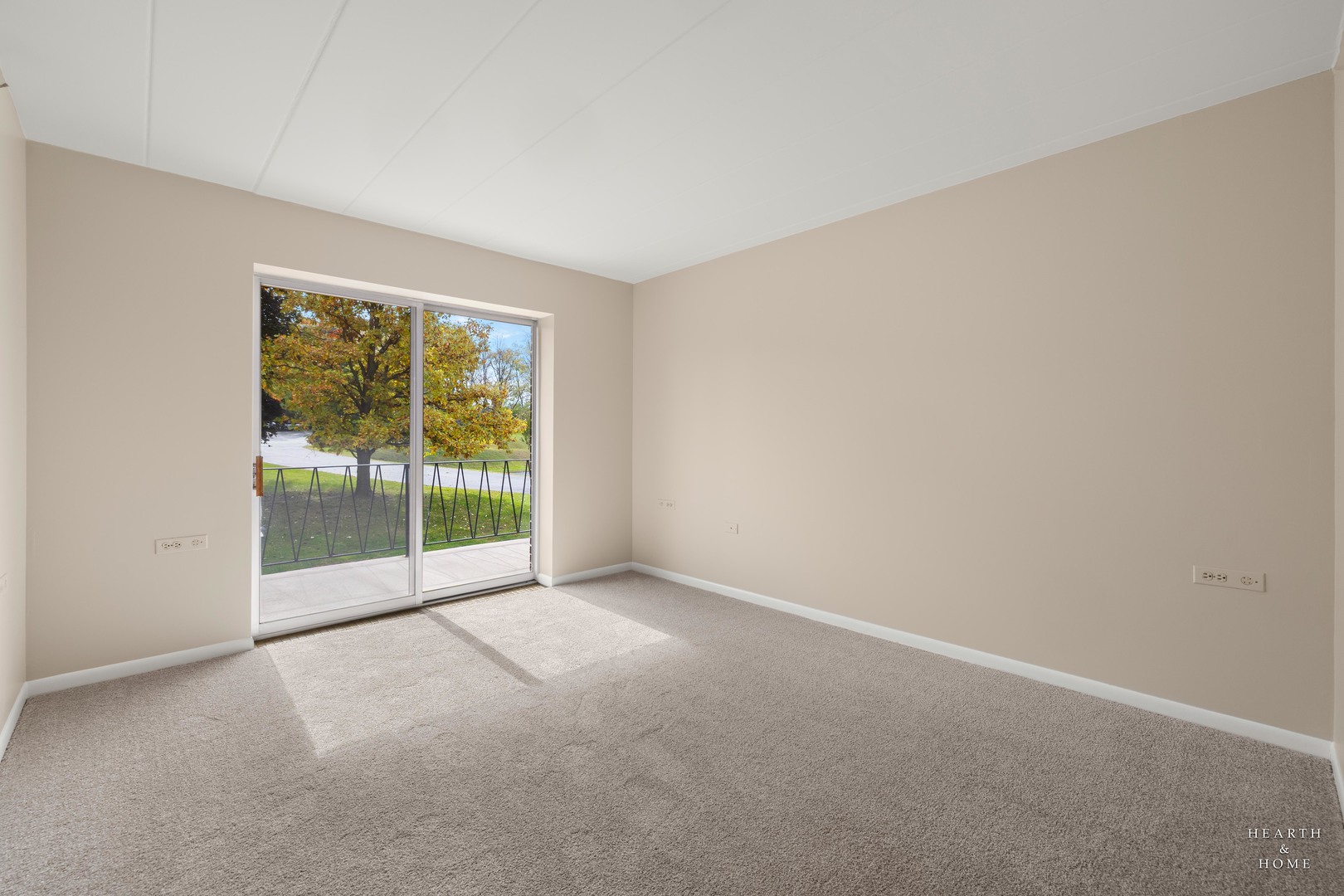 5300 Walnut Avenue, Unit 12B Downers Grove, IL 60515 - Photo 17 of 30 a view of an empty room with glass door