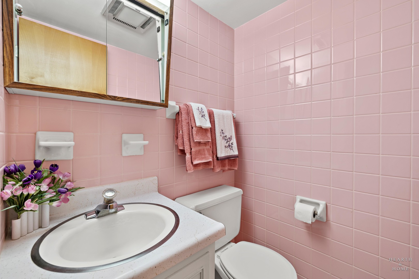 5300 Walnut Avenue, Unit 12B Downers Grove, IL 60515 - Photo 18 of 30 a bathroom with a sink mirror and toilet