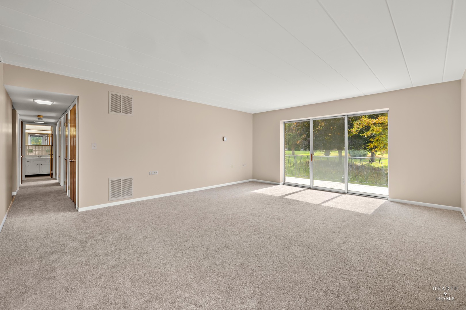 5300 Walnut Avenue, Unit 12B Downers Grove, IL 60515 - Photo 8 of 30 a view of a big room with windows and chandelier fan