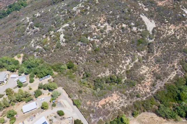 an aerial view of residential house with outdoor space