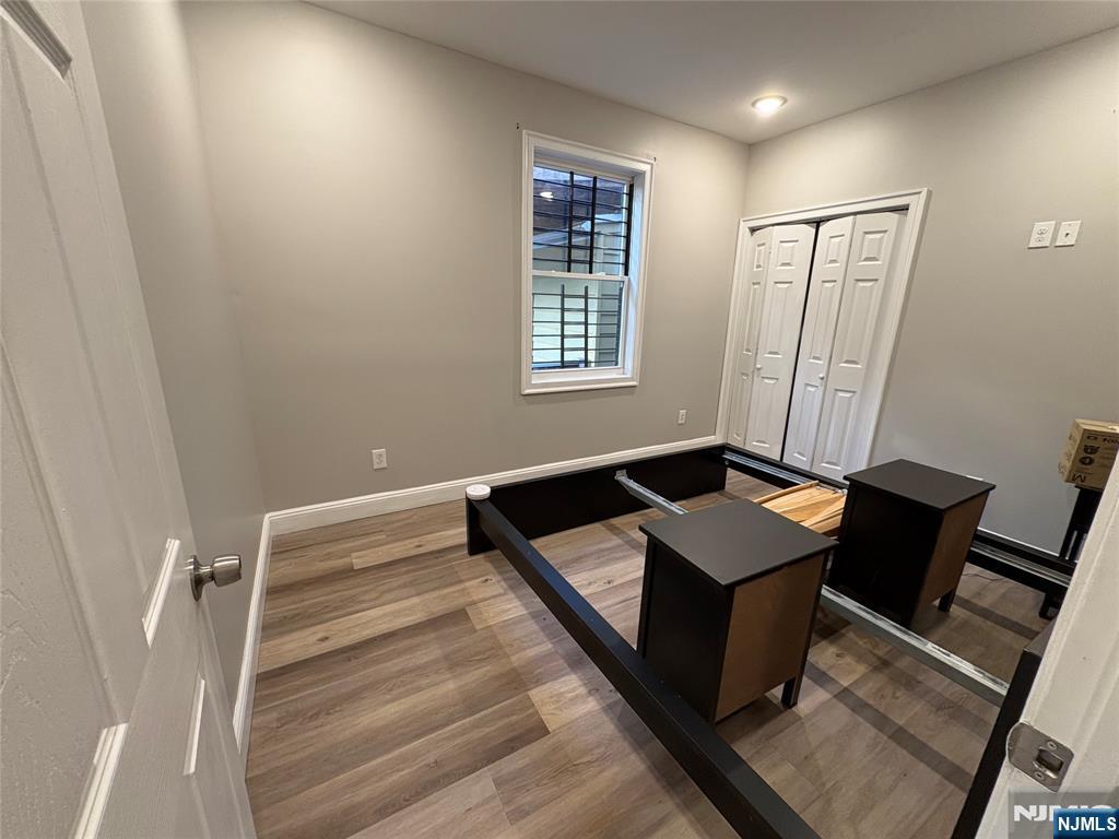 274 Governor Street, Unit 2 Paterson, NJ 07501 - Photo 11 of 15 a bedroom with a bed and a window