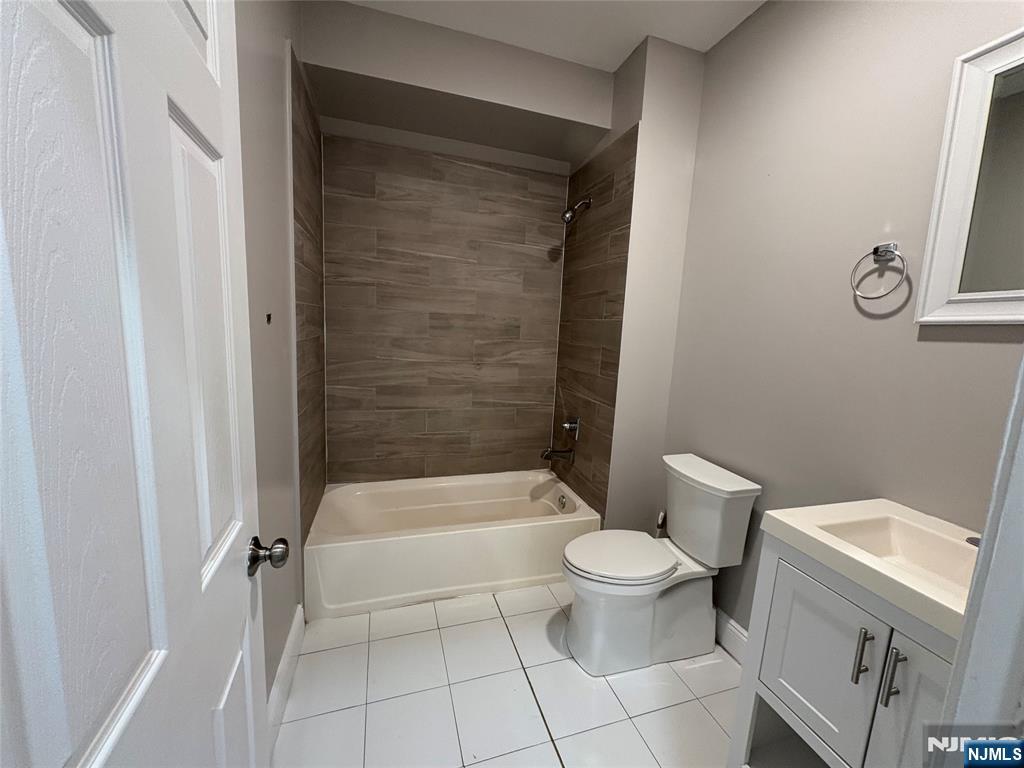 274 Governor Street, Unit 2 Paterson, NJ 07501 - Photo 15 of 15 a bathroom with a toilet and a shower