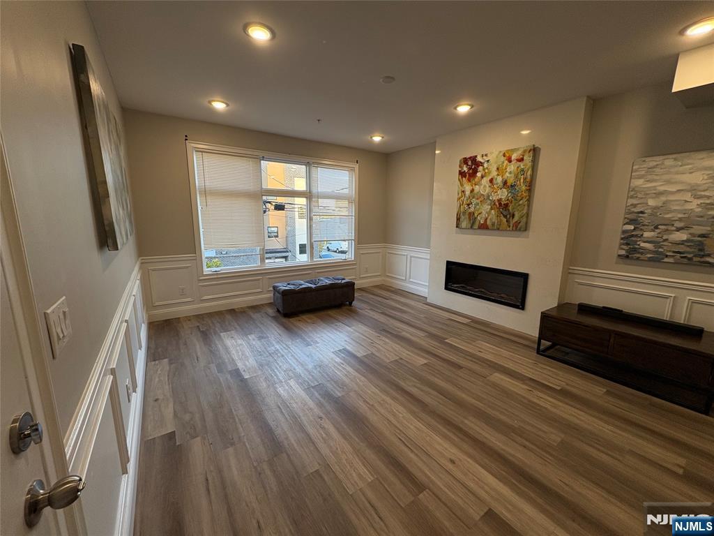 274 Governor Street, Unit 2 Paterson, NJ 07501 - Photo 2 of 15 a living room with furniture and a large window