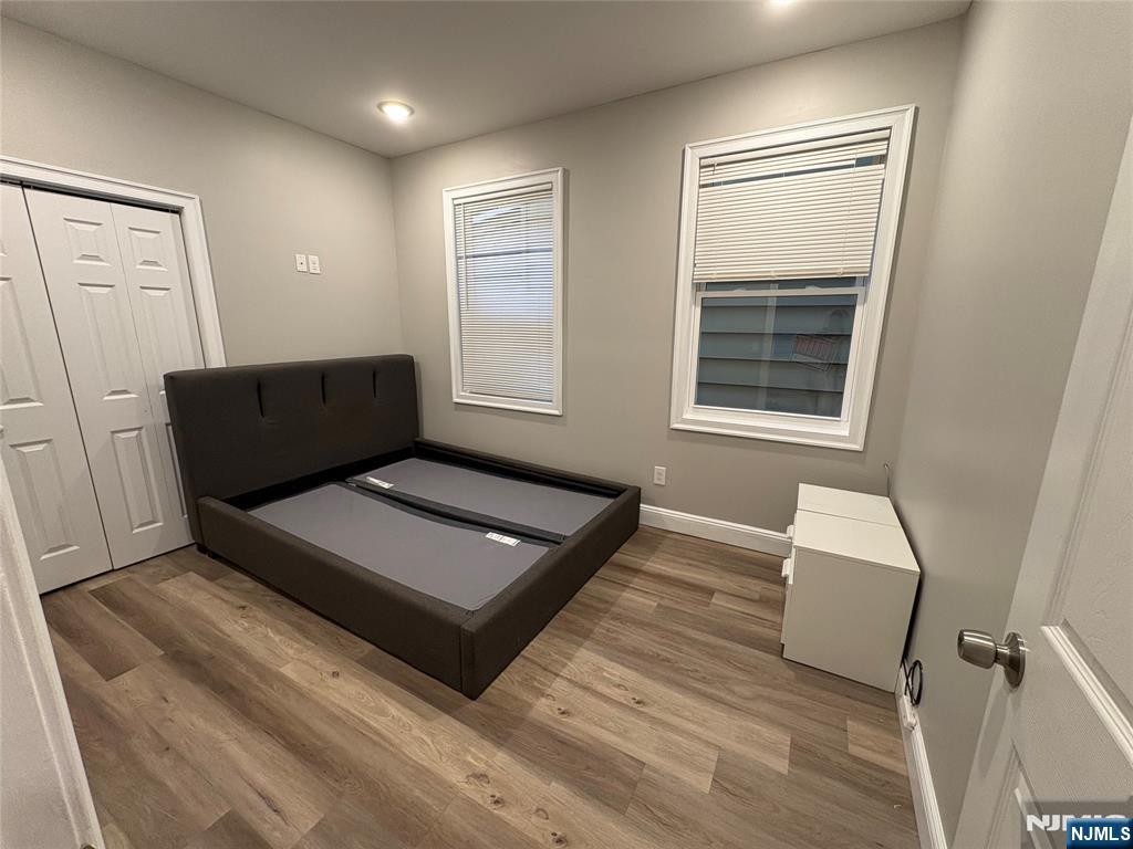274 Governor Street, Unit 2 Paterson, NJ 07501 - Photo 10 of 15 a living room with furniture and a window