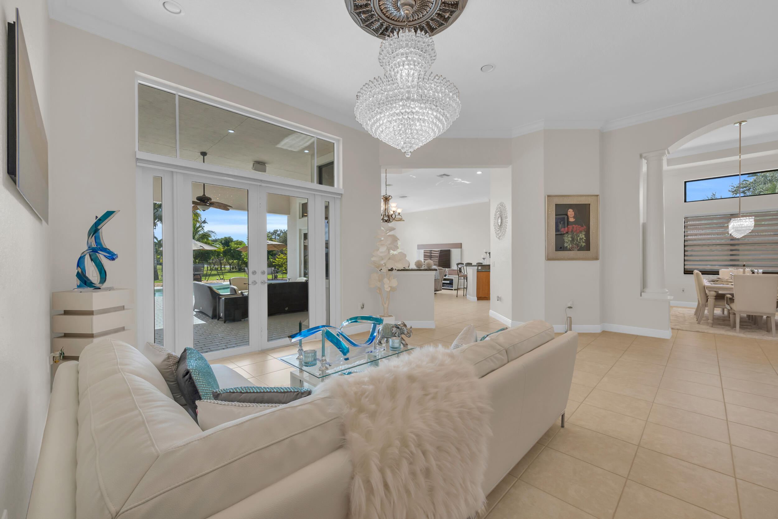 15182 Southwest 35th Street Davie, FL 33331 - Photo 11 of 53 a living room with furniture and a chandelier