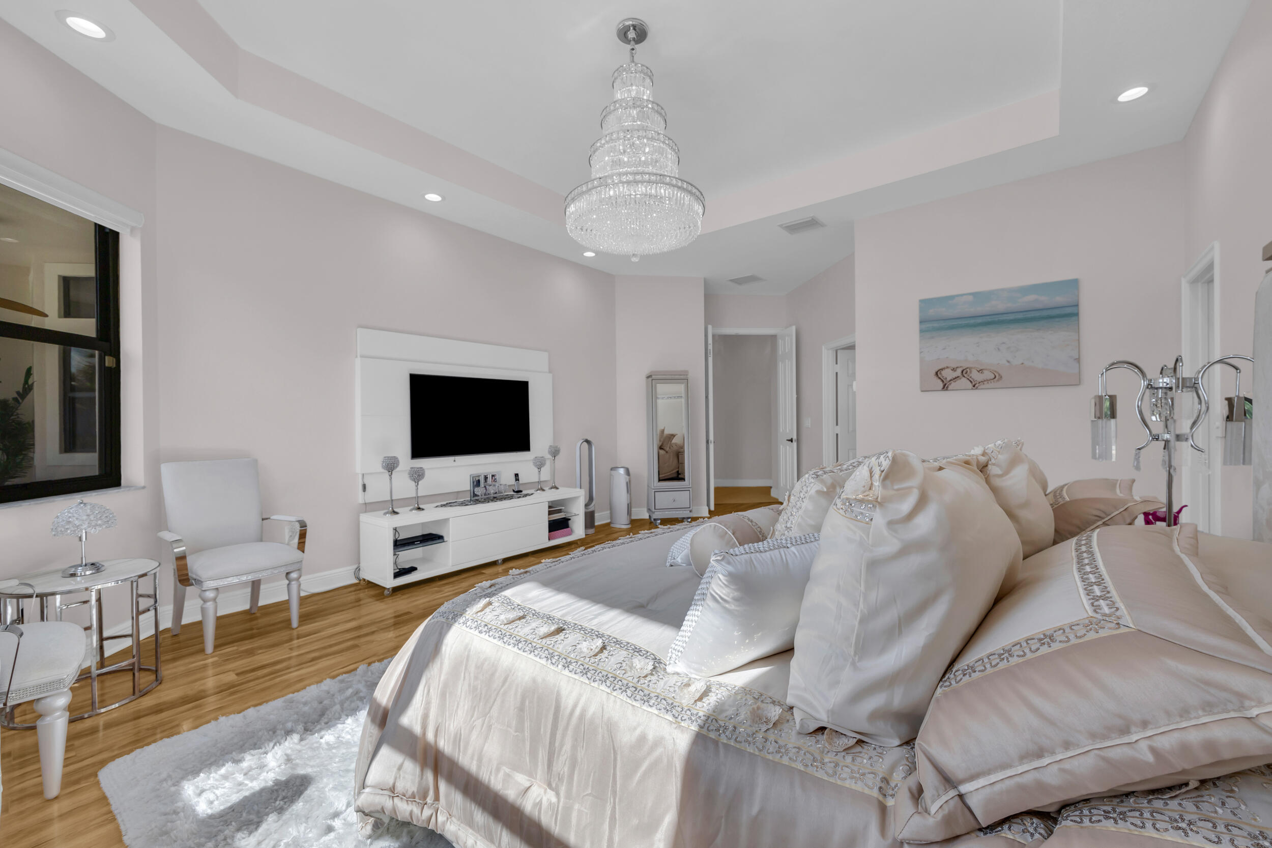 15182 Southwest 35th Street Davie, FL 33331 - Photo 26 of 53 a spacious bedroom with a bed and a flat screen tv