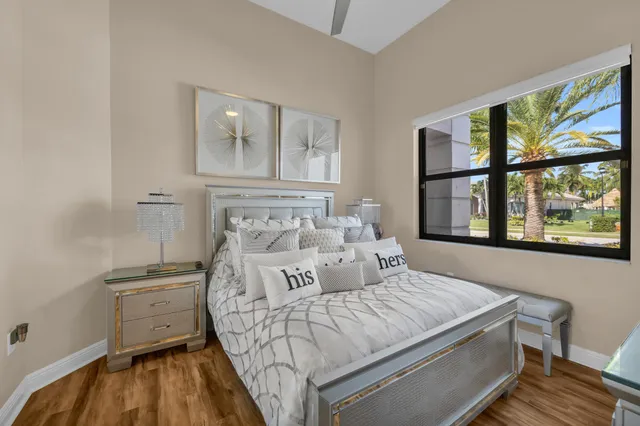 a bathroom with a granite countertop sink a toilet and a mirror