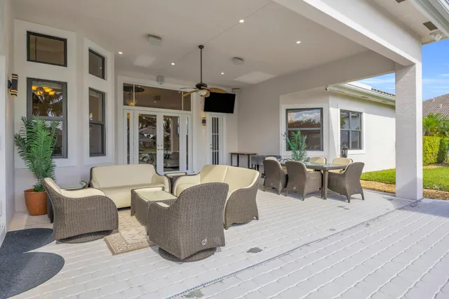 a view of swimming pool with outdoor seating space