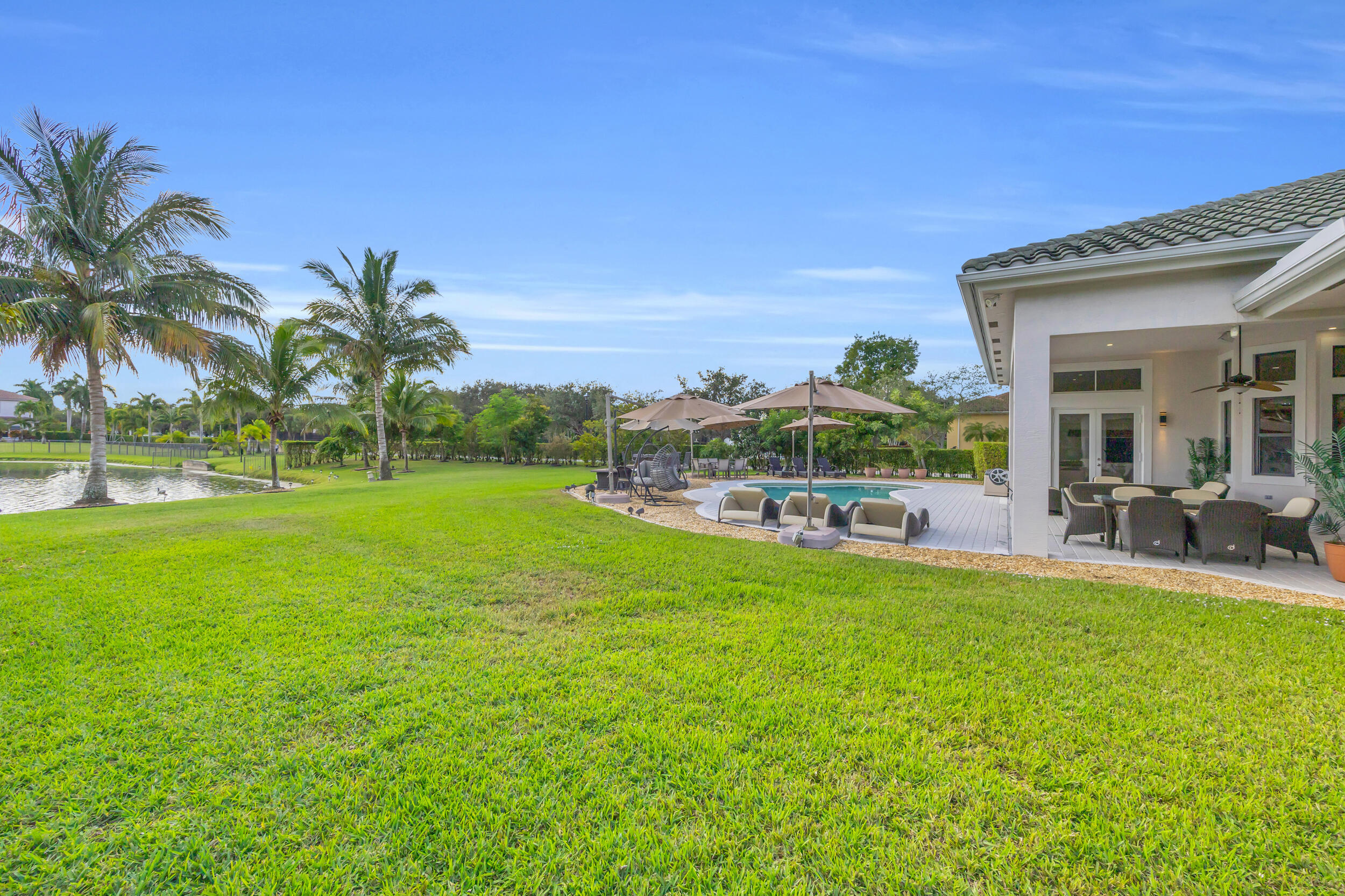 15182 Southwest 35th Street Davie, FL 33331 - Photo 43 of 53 a view of a house with backyard porch and sitting area