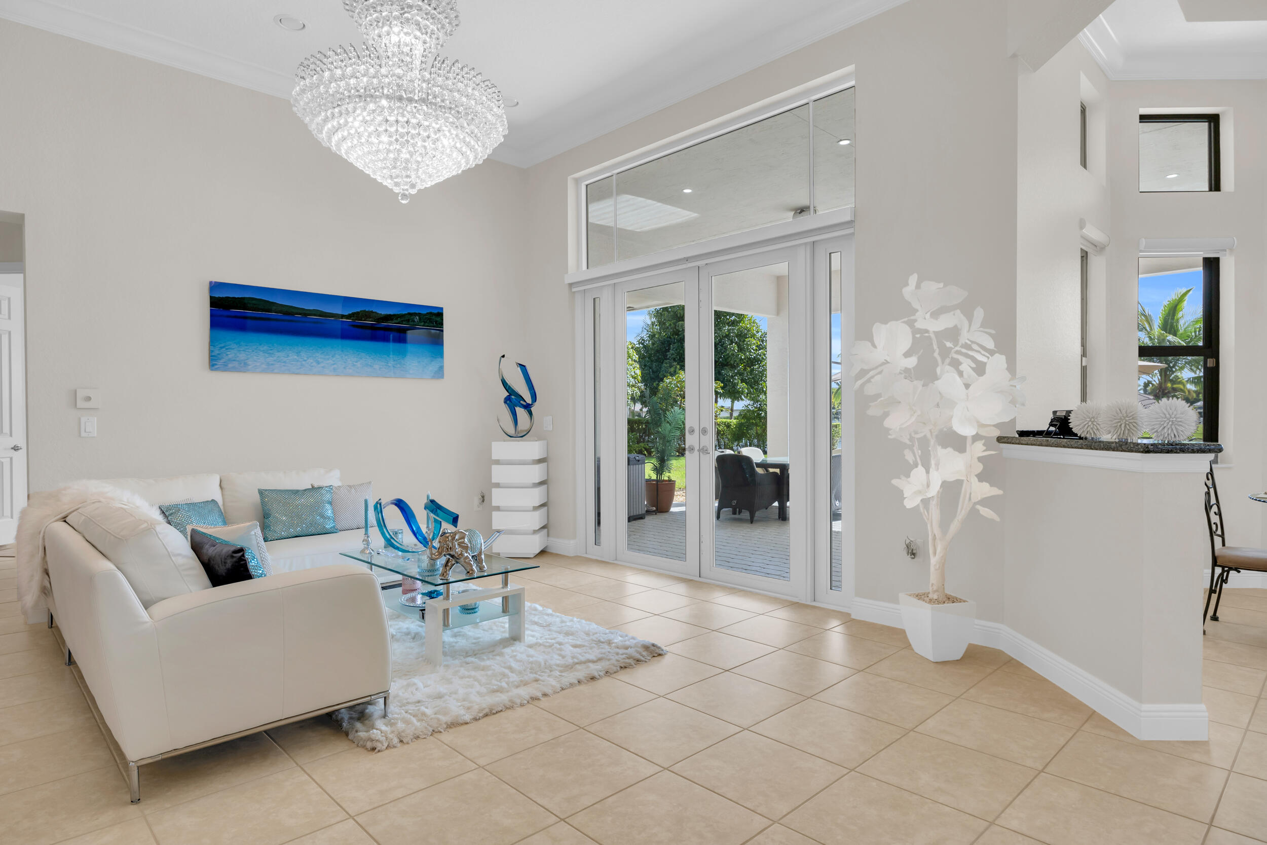15182 Southwest 35th Street Davie, FL 33331 - Photo 10 of 53 a living room with furniture and a chandelier