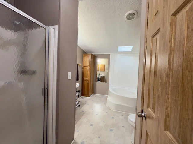 a bathroom with a sink a toilet and tub