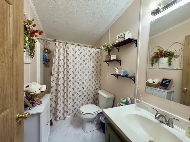 a room with furniture and a flat screen tv