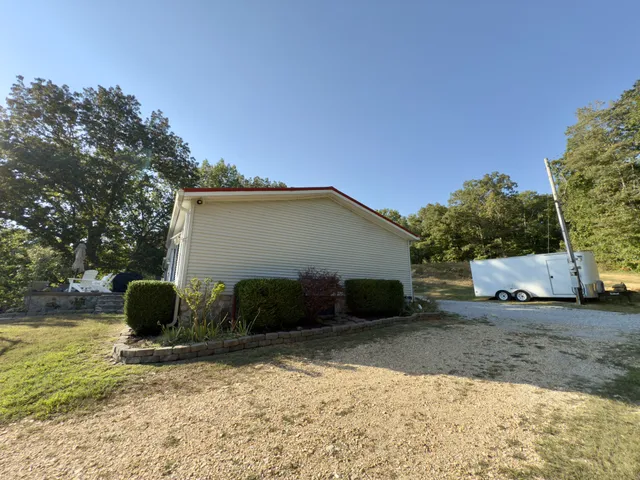 a view of a backyard of the house