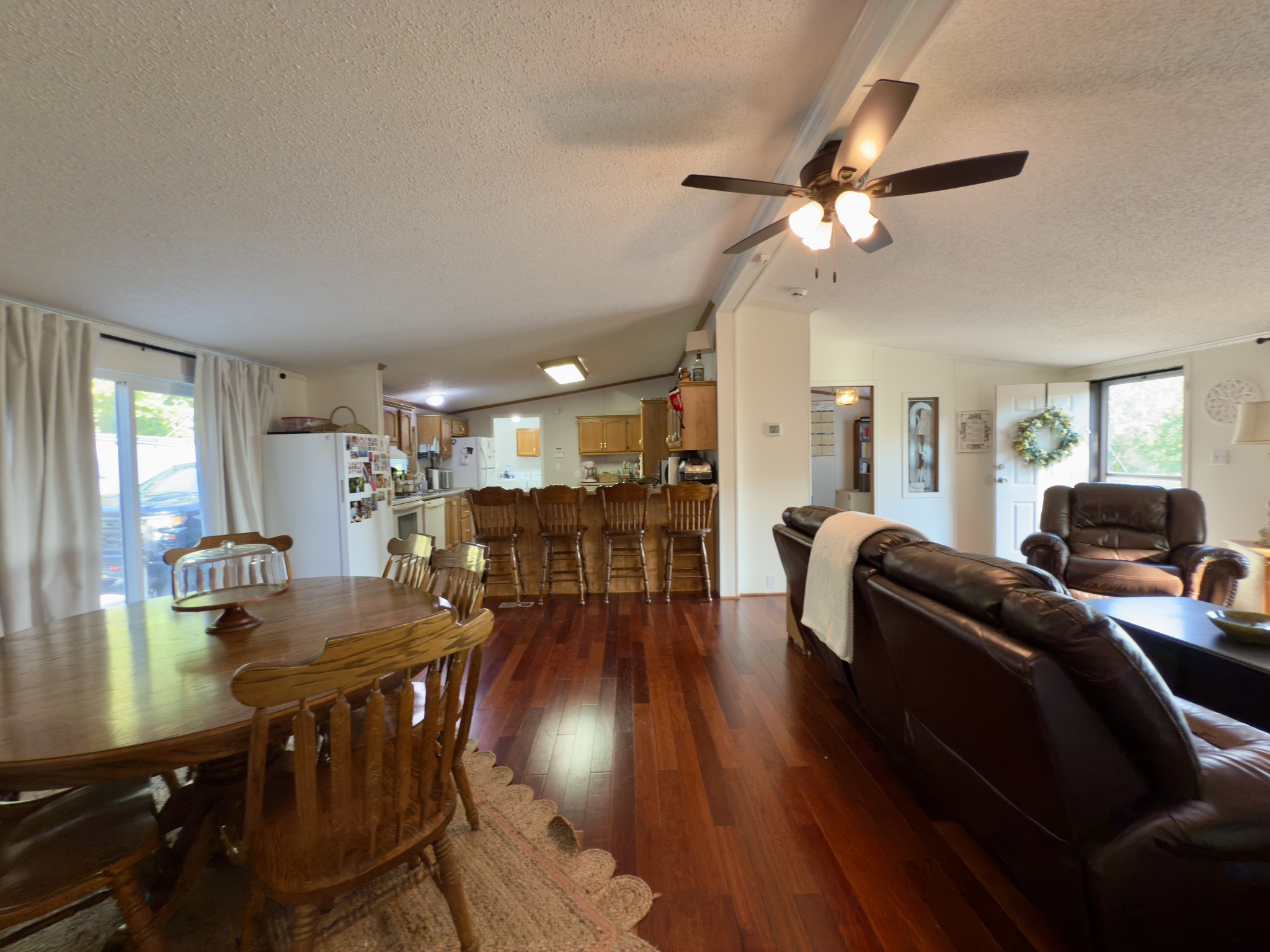 97 Camp Circle Waverly, TN 37185 - Photo 6 of 52 a living room with furniture a ceiling fan and a window