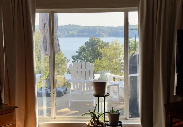 a bedroom with furniture and a flat screen tv