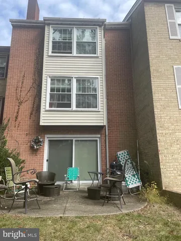 a backyard of a house with seating space