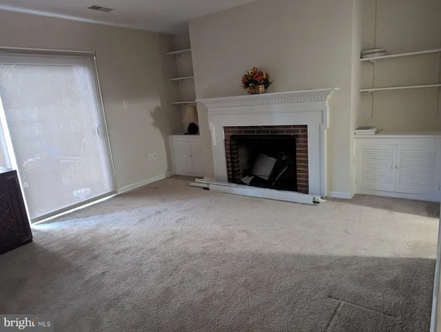 a living room with a fireplace