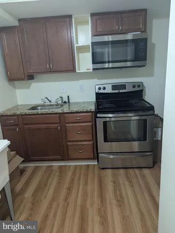 a kitchen with a stove and a sink
