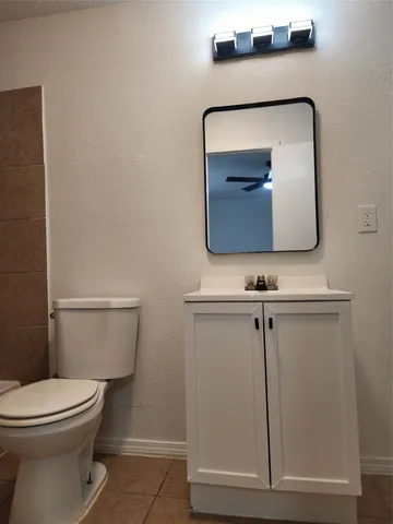 a bathroom with a toilet and a sink