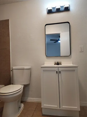 a bathroom with a toilet and a sink