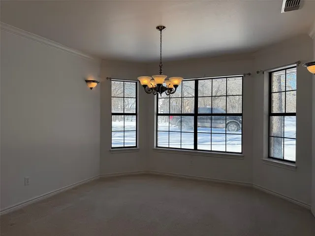 a view of empty room with windows