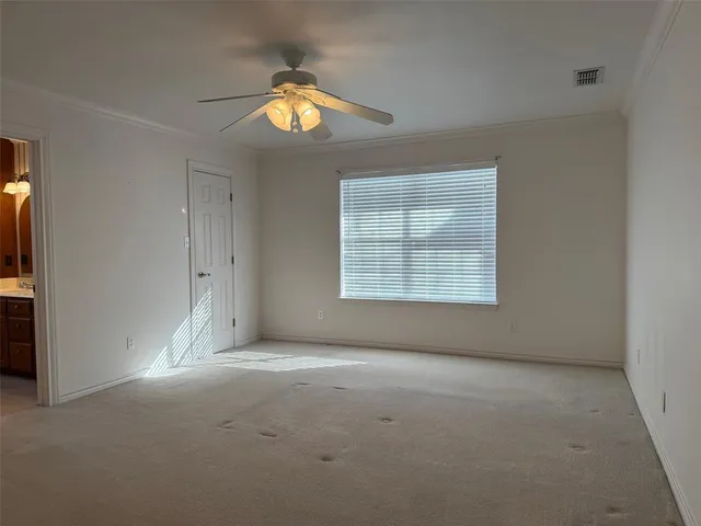 an empty room with a empty space and a window