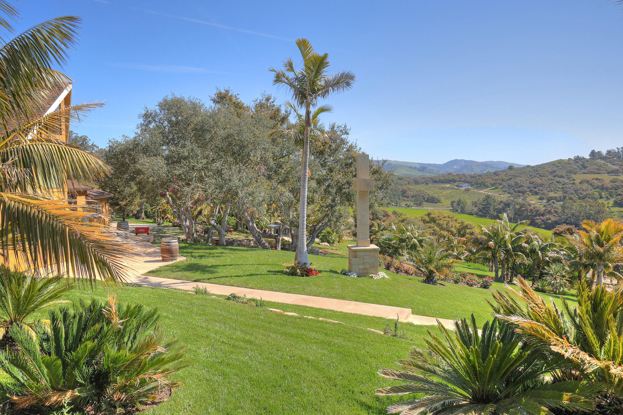 2191 Tularosa Road Lompoc, CA 93436 - Photo 31 of 57 a view of a garden with a building in the background