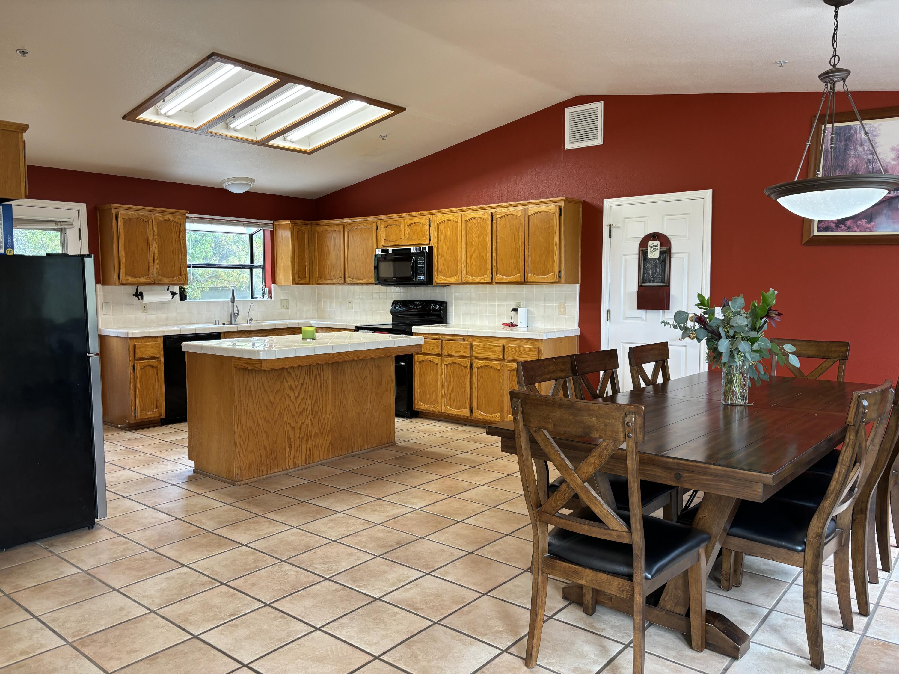 2191 Tularosa Road Lompoc, CA 93436 - Photo 46 of 57 a dining table with chairs and kitchen view