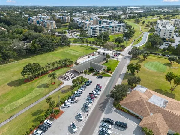 an aerial view of a city with a lake